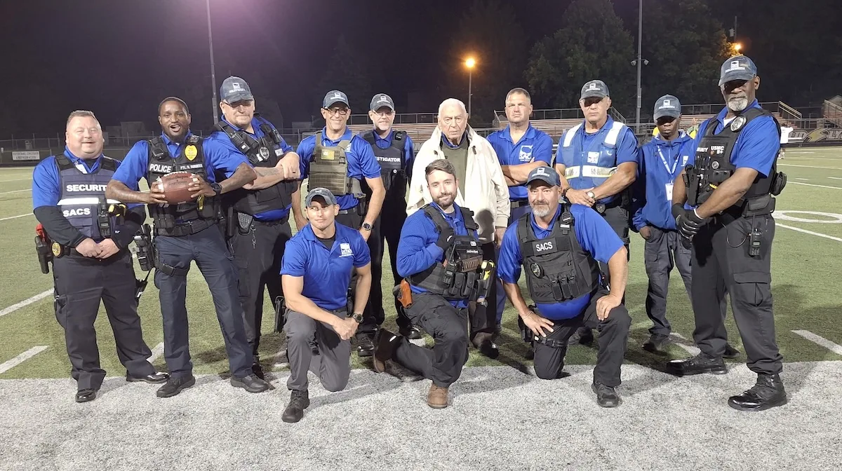 SACS security officers and local law enforcement at local high school football game.
