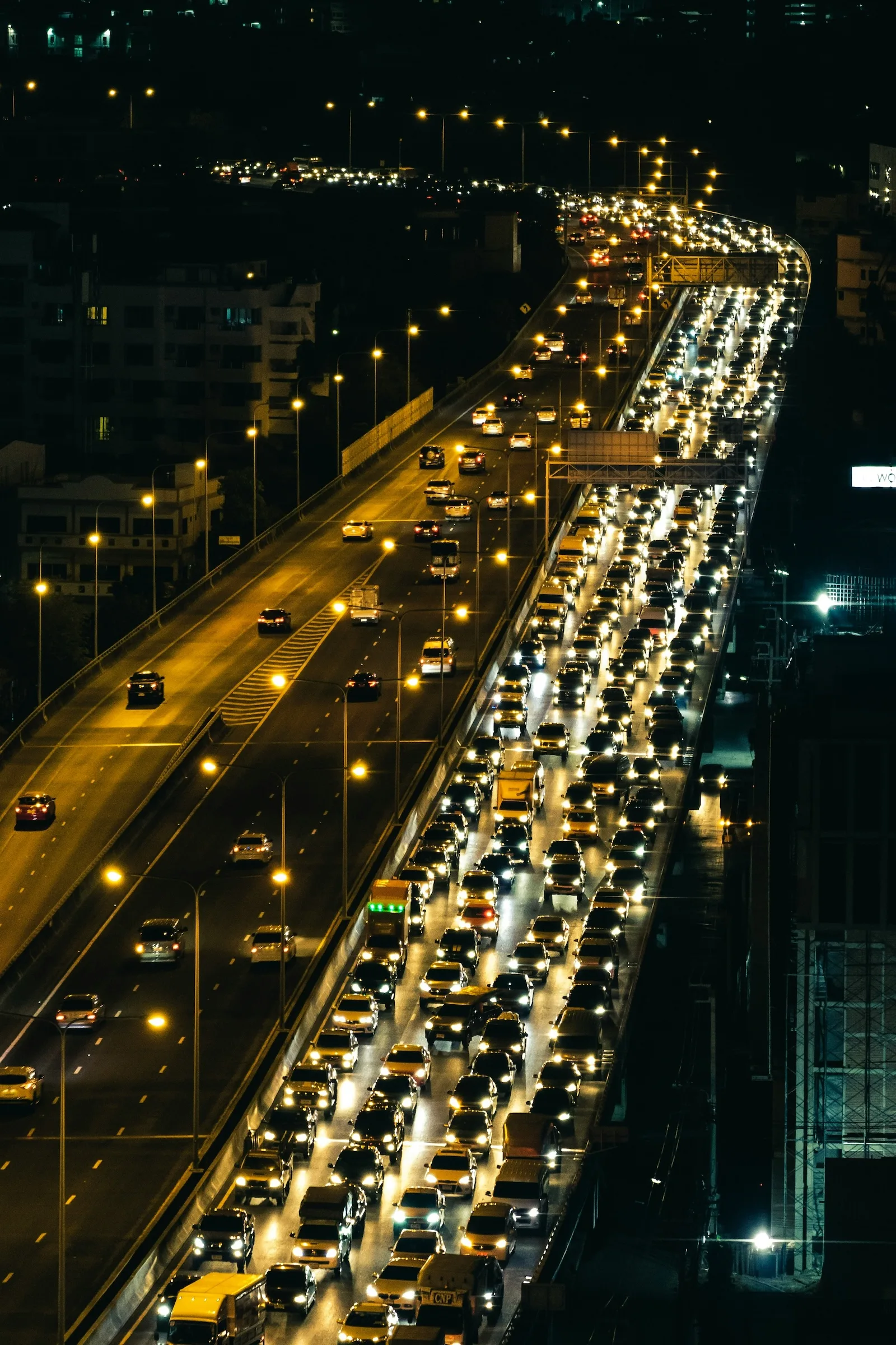 drone footage of city traffic jam at night